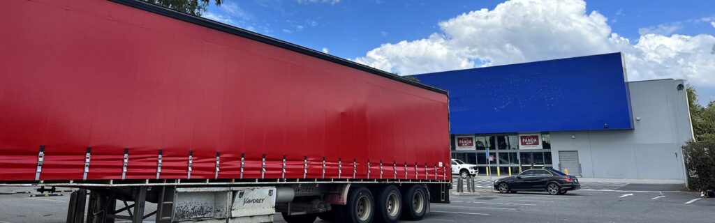 Red tautliner curtain after repair